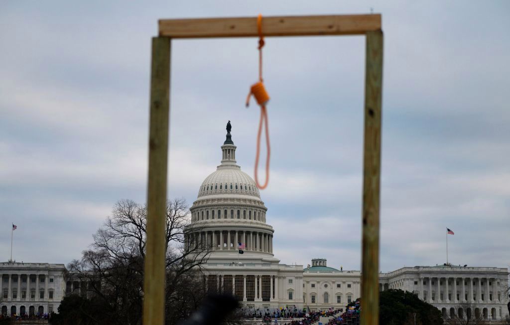  A noose is seen on makeshift gallows in front of the West side of the US Capitol in Washington DC on January 6, 2021. Photo by Andrew CABALLERO-REYNOLDS / AFP